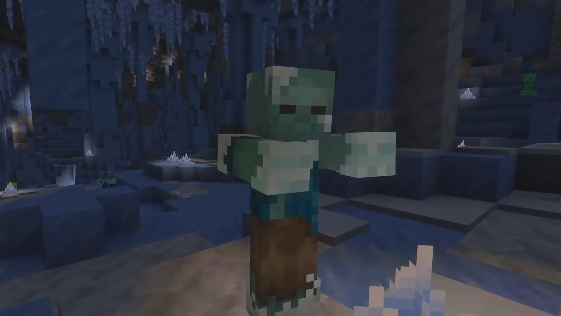 Frozen Zombie w lodowej jaskini z lodowymi kryształami i creeperem w tle, Ice Caves